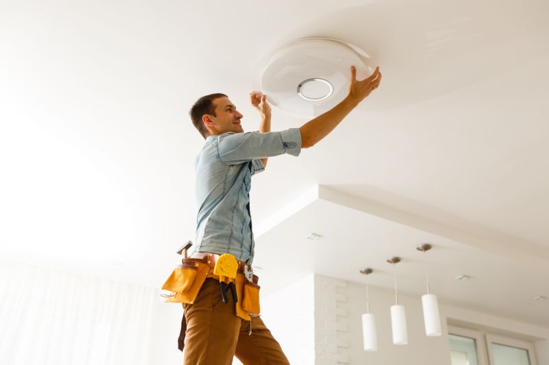 Handyman Installing Light Fixture